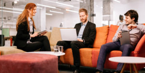 group of employees discuss OnX Canada Web Content Managed Services