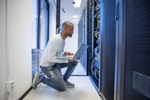 Person in data center representing Onx cloud security
